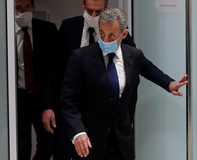 Former French President Nicolas Sarkozy leaves after the verdict in his trial on charges of corruption and influence peddling in Paris. Photo: Reuters