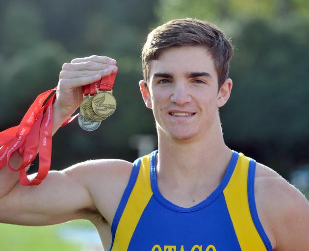 Shay Veitch yesterday shows the four medals he won at the national track and field championships...