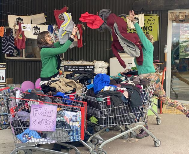 Kat Heap (left) and Kate Martin put out spare clothing from Wanaka Wastebusters to be given away...
