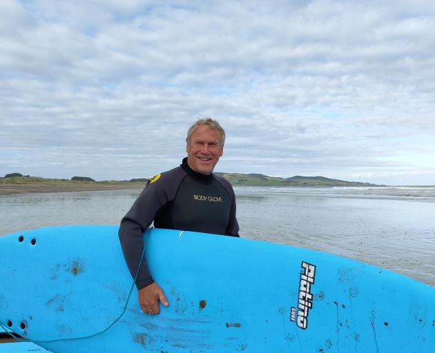 Dairy farmer Craig Tomsett , of Tapanui, gets on board at the Surfing for Farmers programme at...