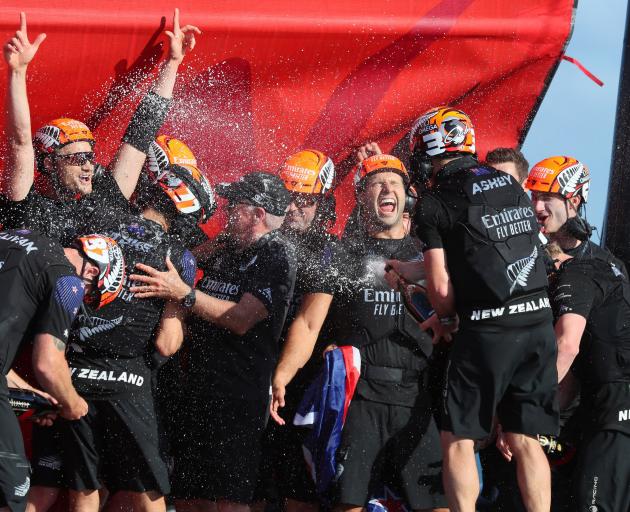 Team New Zealand celebrate winning the 36th America's Cup in Auckland. Photo: Reuters
