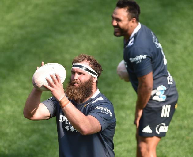 Practising his throwing in is hooker Liam Coltman while replacement hooker Ash Dixon watches...