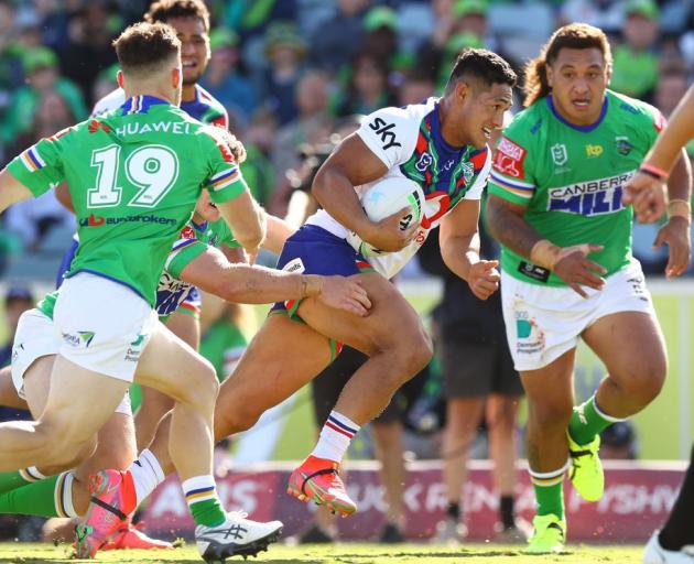 Warriors skipper Roger Tuivasa-Sheck makes a break against the Raiders in Canberra on Saturday....