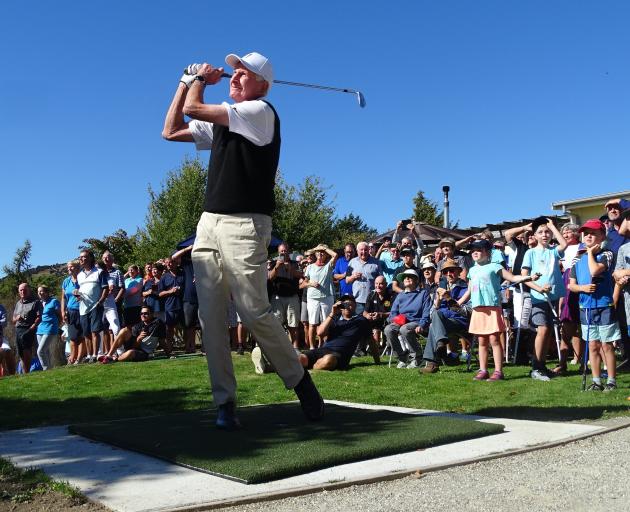 New Zealand golfing great Sir Bob Charles (85) plays the first shot off the first tee on the new...