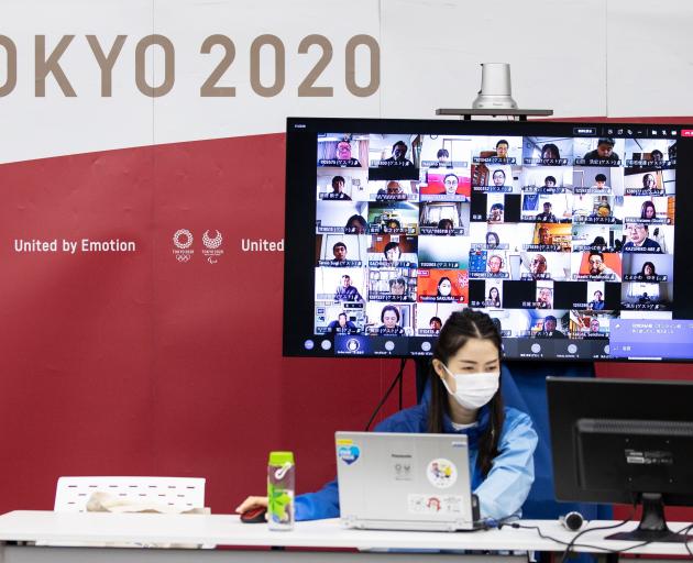 Volunteer training being done online at the Tokyo 2020 headquarters last week. PHOTO: GETTY IMAGES