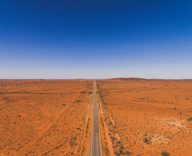Drone footage of a highway from outside Broken Hill, New South Wales in the Australian Outback. Photo: Getty Images