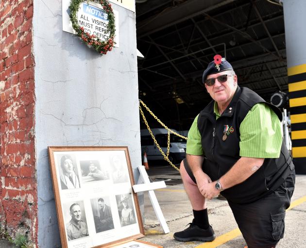 Ex-serviceman Chris Kitto pays his respects to fallen servicemen at the Go Bus depot, in Princes...