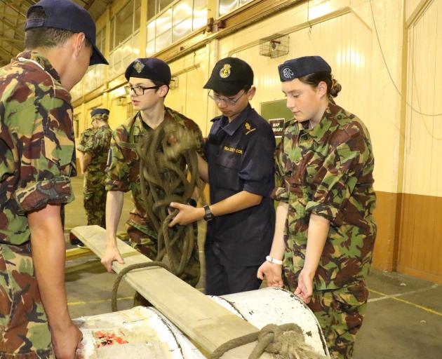 Tying up their barrel during one of the exercises were (from left) Preston Repia-King (15) of...