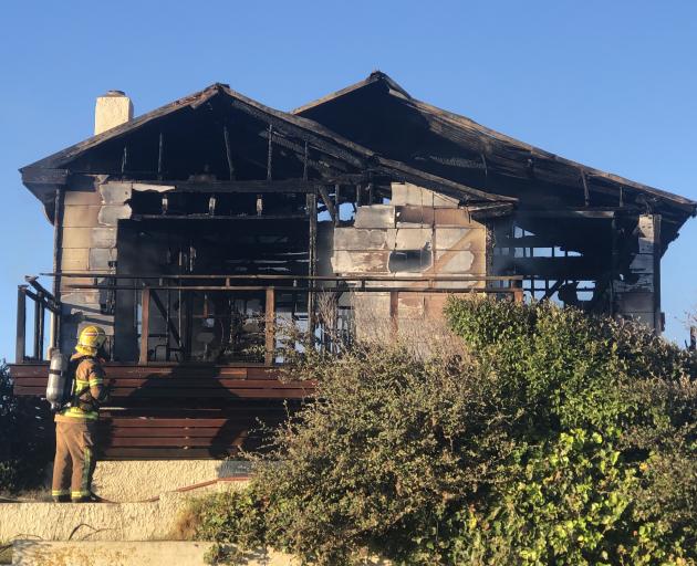 The house in Bluff was fully involved in fire. Photo: Luisa Girao