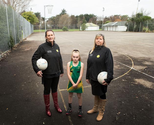 Belfast netball coaches Nikki Martin and Karen Ellis with 11-year-old Asheigh Peters. Photo:...