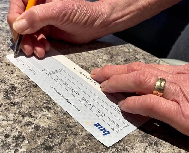 Paying by cheque is becoming obsolete, to the disappointment of many seniors. Photo: Geoff Sloan 