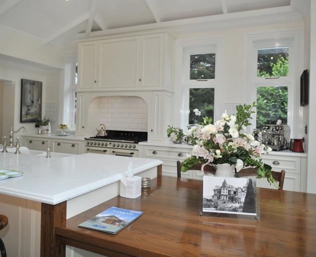 Mod cons are hidden from view in the traditional-style kitchen.