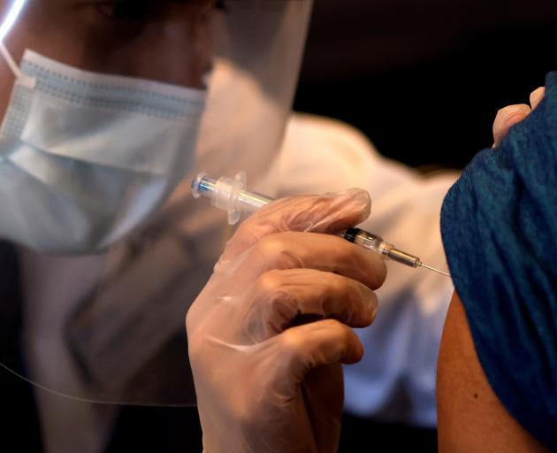 A person receives a dose of the Johnson & Johnson vaccine in Chicago last week. Photo: Reuters