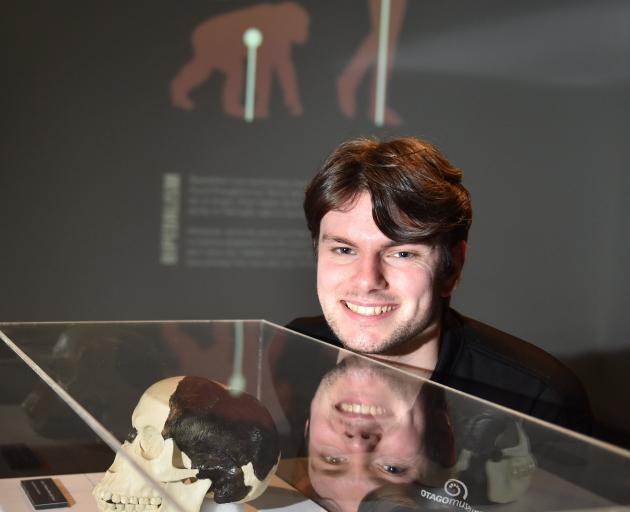 Otago Museum science communicator Quinn Hawthorne examines an exhibit from a new museum show on...