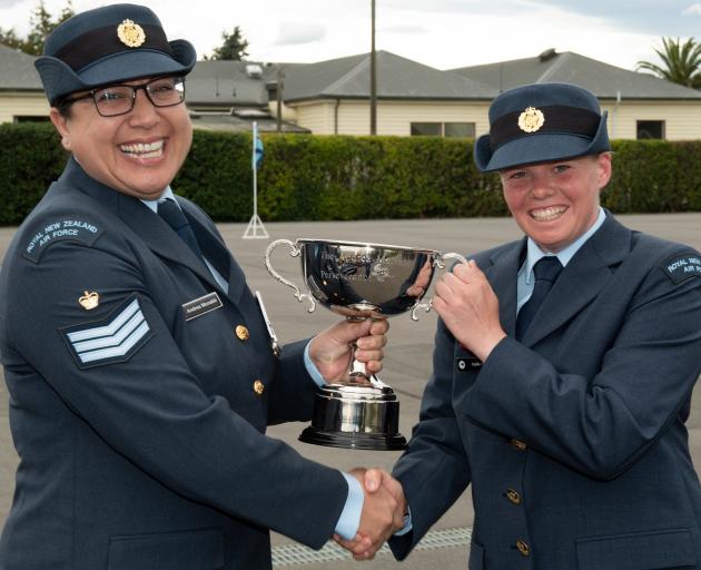 Aircraftman Sophie Aitken (right), of Queenstown, receives the Andrea McNabb Perseverance Cup...