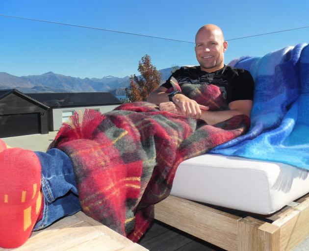 Beating the chill  with mohair throws and socks designed locally is Steven Hobson. PHOTO: SIMON...