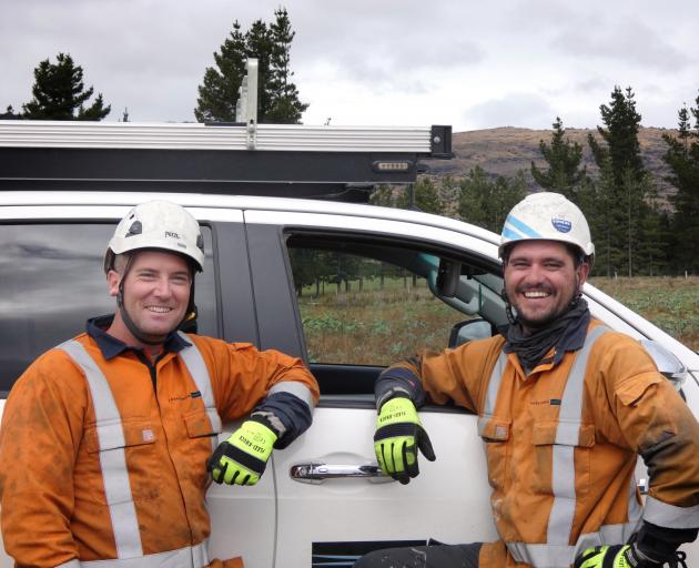 Electrix transmission and distribution line mechanics Scott Mulcahy (left) and Sean ‘‘Stewie’’...