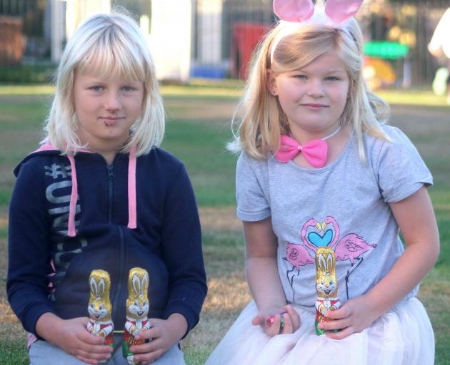 Kakanui School pupils Tilly McKnight (left) and Kate Ransby(both 7) hold some of the Easter treats left by the mysterious Kakanui Easter bunny on Thursday. PHOTO: KAYLA HODGE Kakanui School pupils Tilly McKnight (left) and Kate Ransby(both 7) hold some of the Easter treats left by the mysterious Kakanui Easter bunny on Thursday. PHOTO: KAYLA HODGE