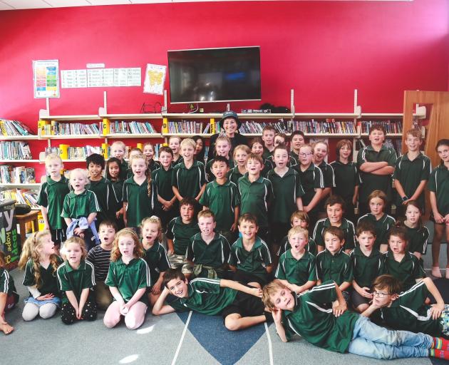 Waikaka School pupils say goodbye at her farewell function yesterday. Photo: Rebecca Ryan