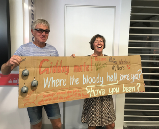 Friends and family of those on the flight into Queenstown are waiting with signs in the arrivals lounge. Photo: RNZ
