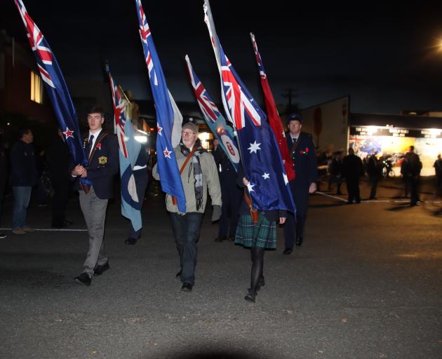 The flag bearers lead the Anzac Day dawn parade down Gore’s Mersey St to the cenotaph. PHOTO:...