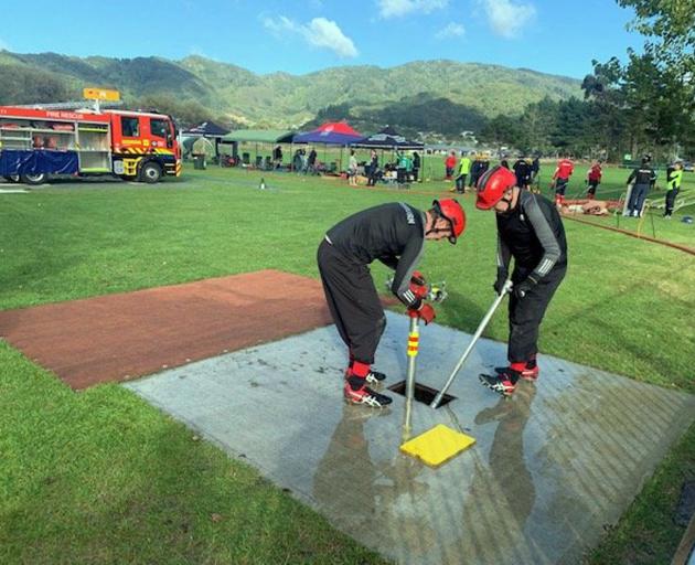  Mossburn volunteer firefighters Stephen Trusler and Jeff Manson take part in the United Fire...