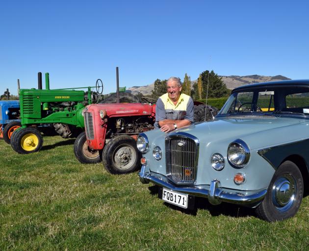 John Tremaine relaxes on his 1964 Wolseley 6/110 in Mandeville ahead of his clearing sale on...