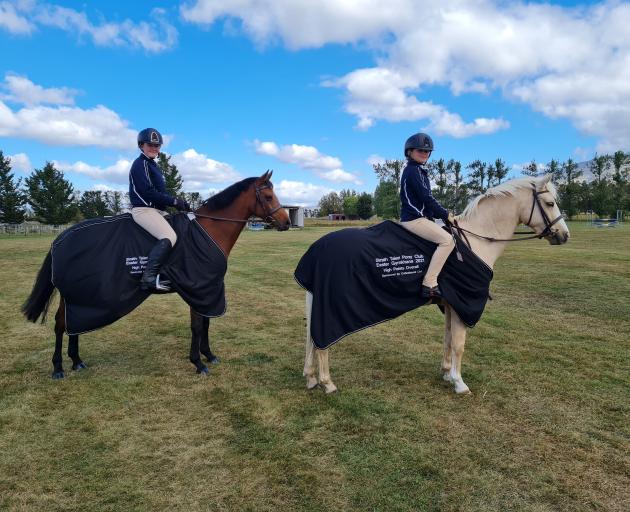 Strath Taieri Pony Club members Sarah Hay (16, left) rides Beechcroft Le Dance and Neave O...