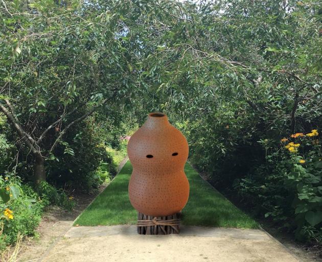 A sculpture created by Kate Fitzharris using on-site materials can be seen next to the Cherry...