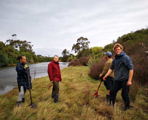 Getting stuck in to the riparian planting are (from left) Dennis Kahui, Andy Hutcheon, Heath...