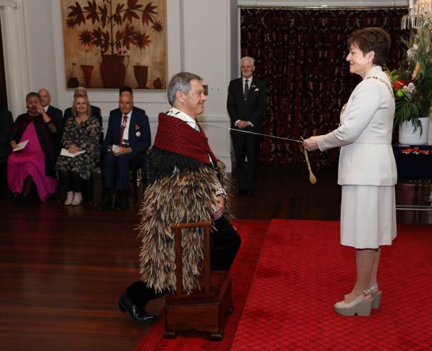 Dame Patsy knights Sir Ian at Government House yesterday. PHOTO: DOUG MOUNTAIN/Government House 
