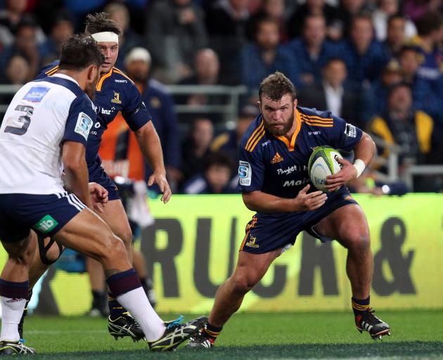 Coltman tries to go round Blues prop Angus Ta’avao at Forsyth Barr Stadium in 2015.