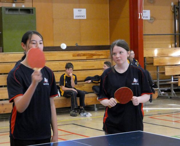 Waiau Area School pupils Deija-Lee Crawford (14) and doubles partner Madisyn Gibbs in action...