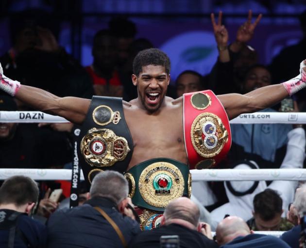 Anthony Joshua celebrates after beating Andy Ruiz to win back the heavyweight titles in his most...