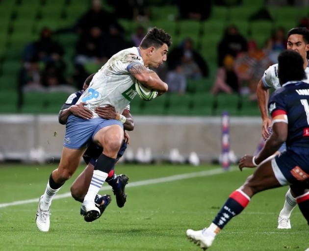 Bryce Heem of the Blues fends off a tackle in the match against the Rebels in Melbourne. Photo: Getty Images