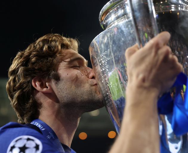 Chelsea's Marcos Alonso celebrates with the trophy after winning the Champions League Pool via...