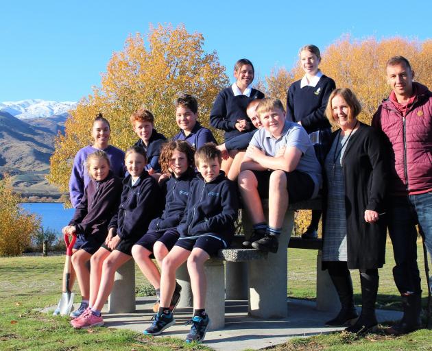 Encouraging the protection of Lake Dunstan’s shoreline are (front, from left), Pixie Swain, Lily...