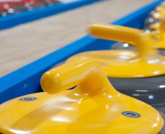 Brand new curling stones sit ready to use at the rink