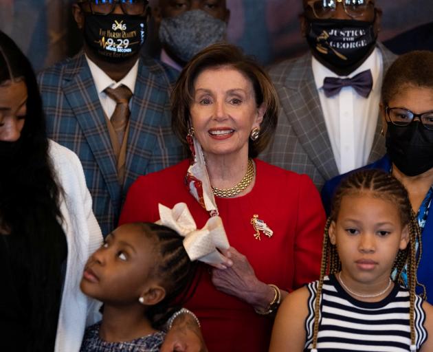 House speaker Nancy Pelosi with members of the Floyd family including daughter Gianna (below left...