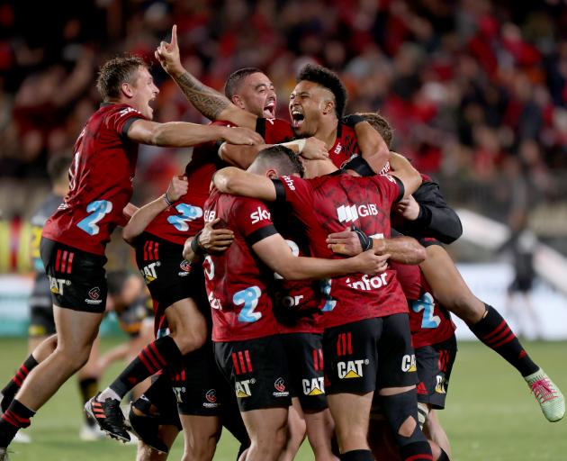 The Crusaders celebrate after winning a tense final against the Chiefs in Christchurch. Photo:...