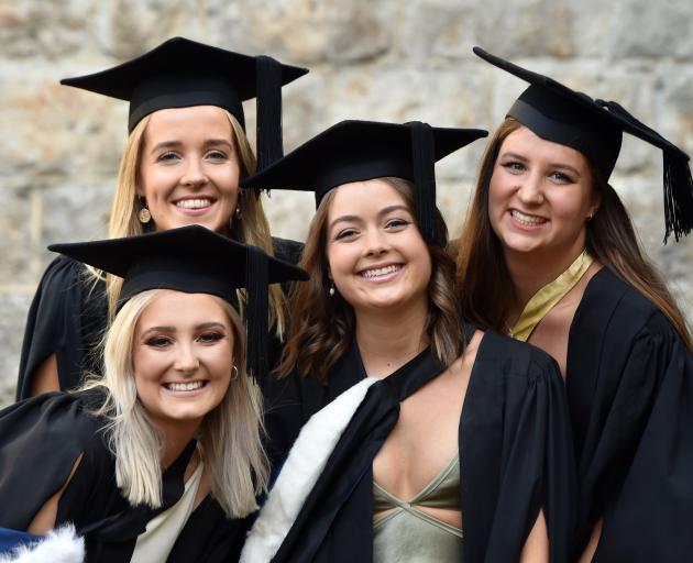 Graduands (from left) Annie Robertson (21), Phoebe Caldwell (21), Hannah Easton (22) and Emily...