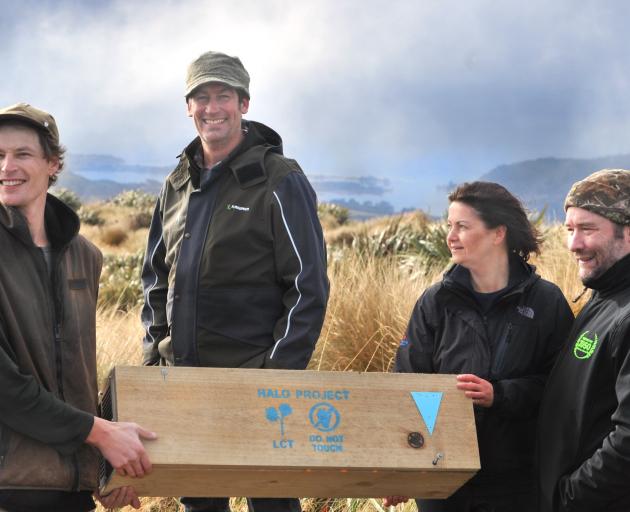 Marking a major milestone on Swampy Summit yesterday are (from left) Halo Project manager Jonah...
