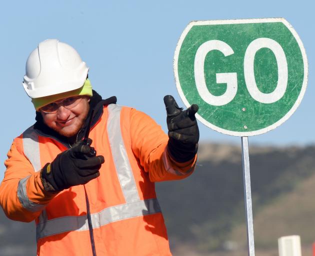  Downer Construction traffic controller Jarryd Osborne entertains waiting drivers with his moves...