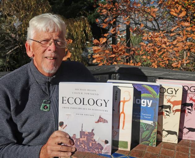 Emeritus Prof Colin Townsend, of Wanaka, with the newly published fifth edition of his book...