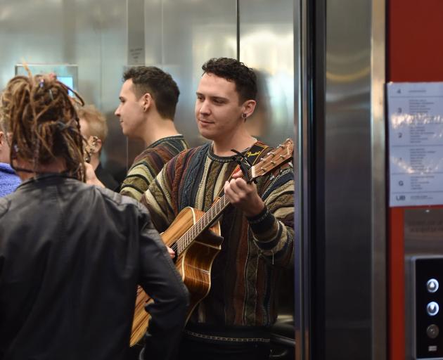 Dane Oates performs in a lift at the Dunedin City Library as part of the Nook and Cranny Music...