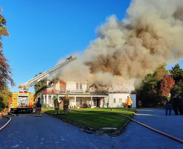 Fire crews work to extinguish a fire at Te Kiteroa Retreat & Historic Homestead in Waimate on...