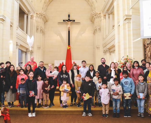 Some of St Joseph’s School’s 23 new pupils and their families gather at St Patrick's Basilica...