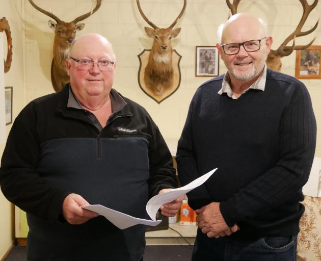 New Zealand Deerstalkers Association North Otago president David Hay (left) and hut project co...