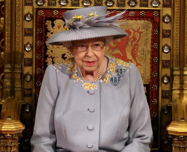 The Queen wore a day dress instead of the usual robes and crown for the State Opening of...