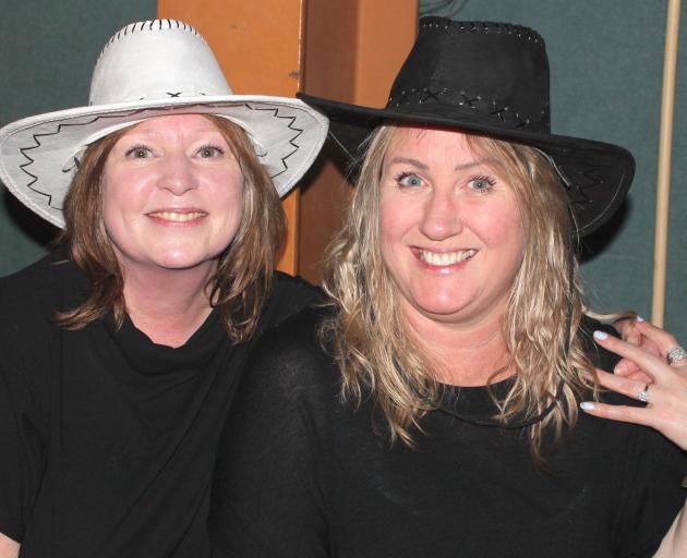Angela Fairbrother (left) and Carmen Lapthorne get into the country spirit.